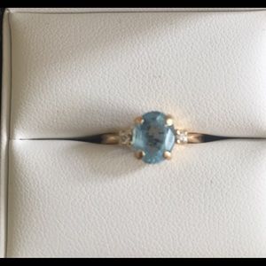 14k oval blue topaz, 2 small diamonds 4 1/2 ring